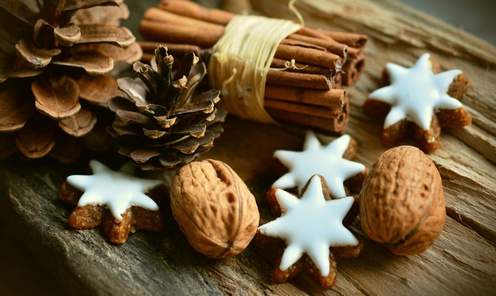 Christmas cookies, pine cones, cinnamon sticks, and walnuts
