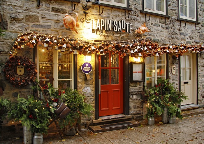 Charming Evening Street Scene in Quebec with Festive Decorations