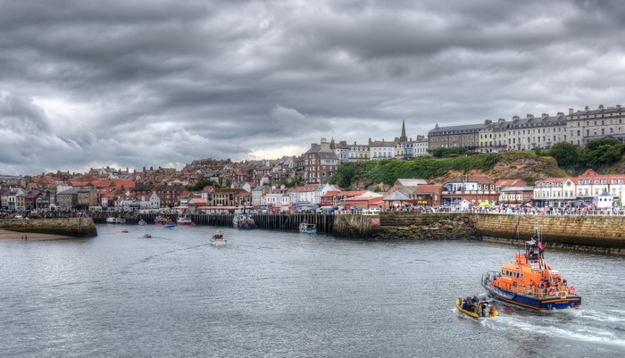 Whitby Harbour with boats and town on the hill