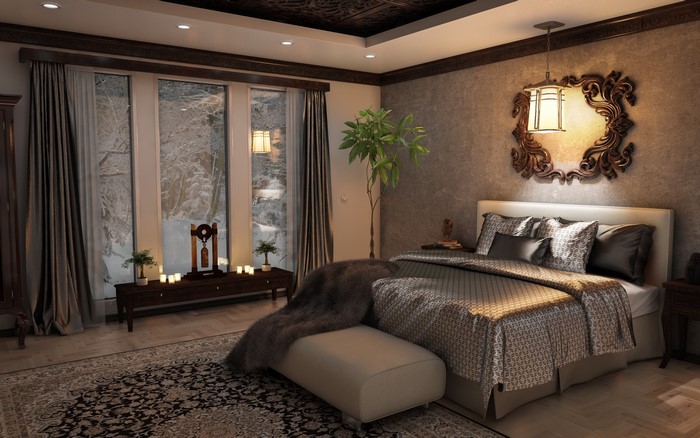 Bedroom with large windows and a bed