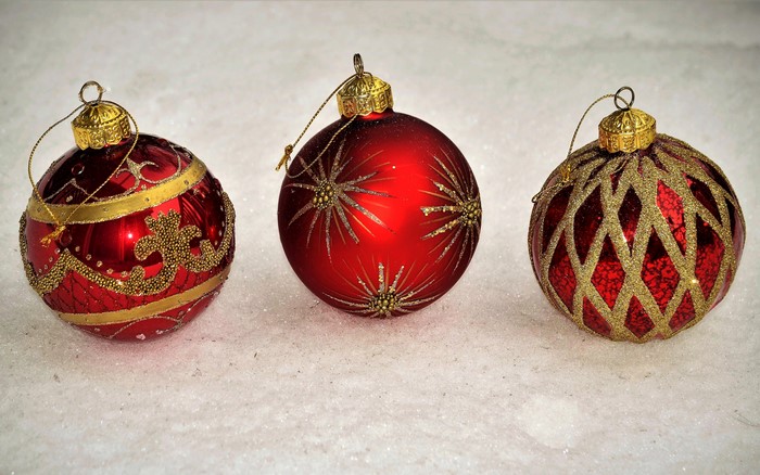 Three red Christmas balls with gold decorations