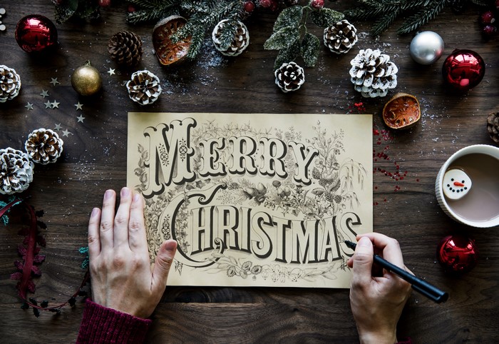 Merry Christmas calligraphy with Christmas decorations