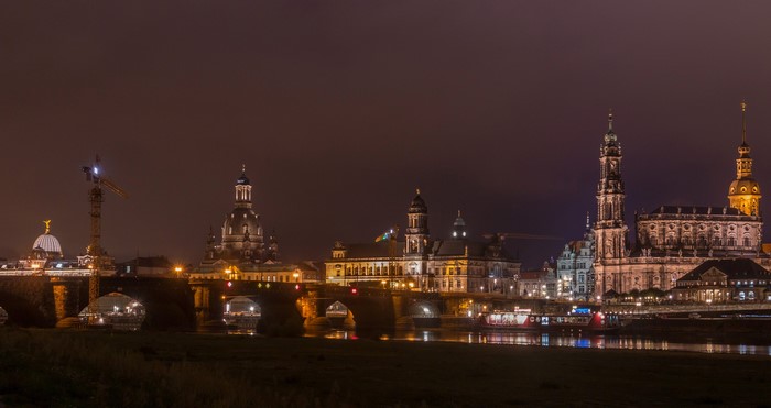 Dresden skyline with bridges and river at night