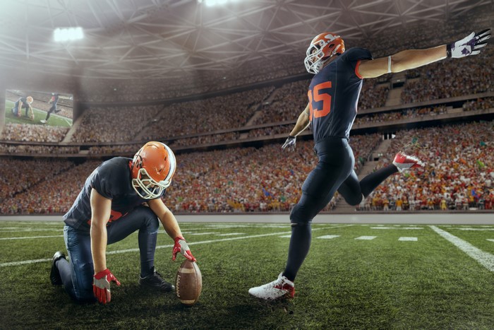 American football players in uniform on field