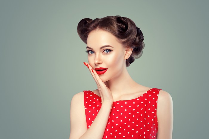 Woman with retro hairstyle and red polka dot dress