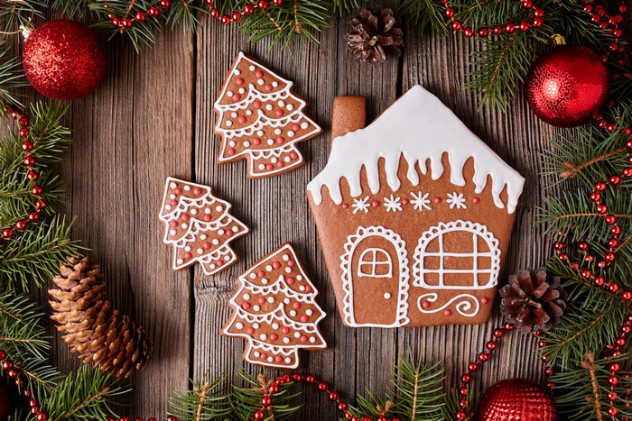 Christmas gingerbread house and trees on wood