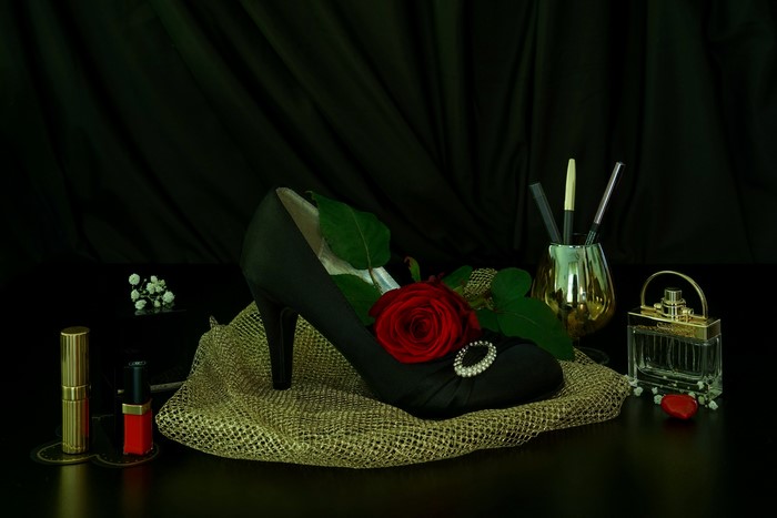 Black stiletto with red rose and perfume