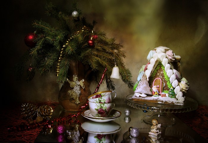 Christmas still life with gingerbread house and tree