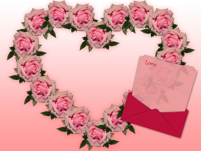 Heart shape made of pink roses with love letter