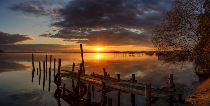 Sunset over Lake Ogawara with a wooden pier