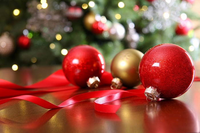 Christmas ornaments and ribbon on a table