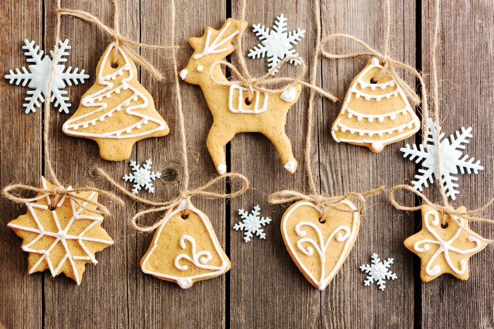 Christmas gingerbread cookies and snowflakes on wood