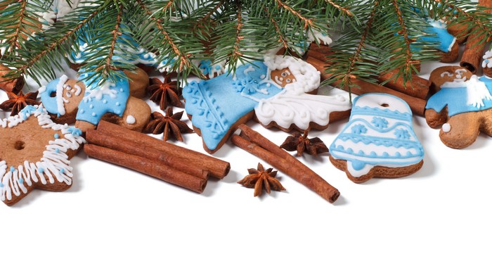 Christmas cookies with pine branches and cinnamon sticks