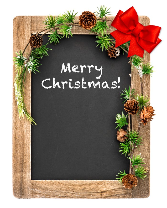 Christmas chalkboard with pine cones and red bow