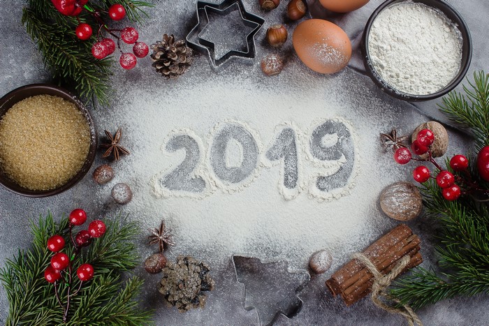 Christmas baking ingredients and 2019 written in flour
