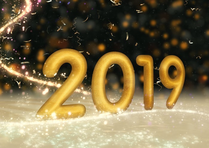 Golden 2019 numbers with confetti and bokeh