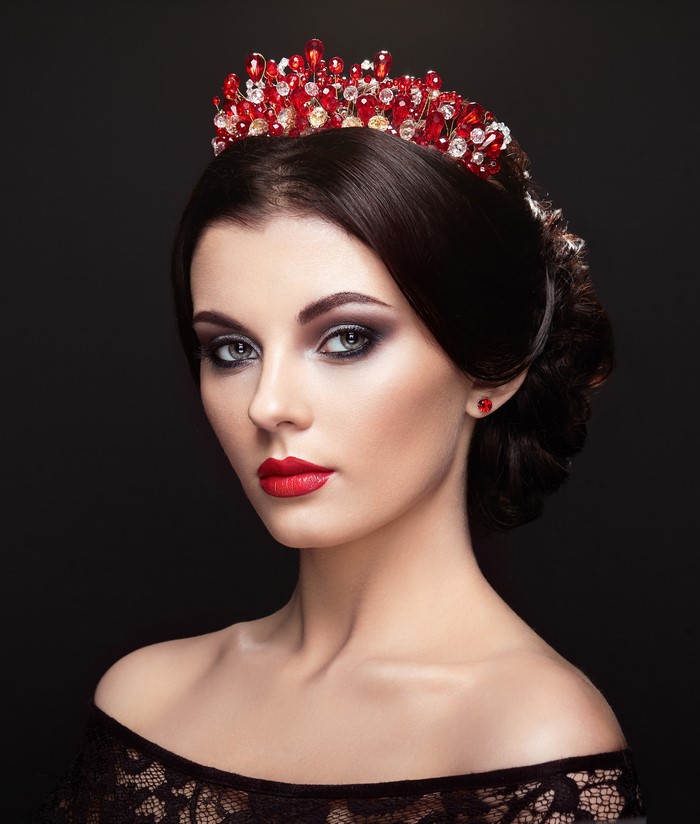 Woman with red crown and black lace