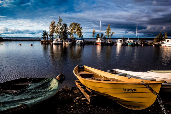 Boats docked in a marina in Tampere, Finland at dusk