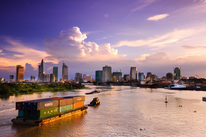 Saigon Vietnam Skyscrapers and Container Ship at Sunset