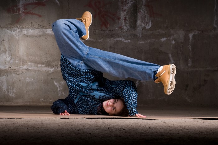 Breakdancer performing a headstand