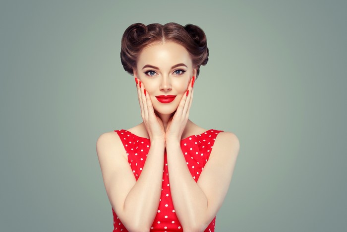 Woman with retro hairstyle and red polka dot dress