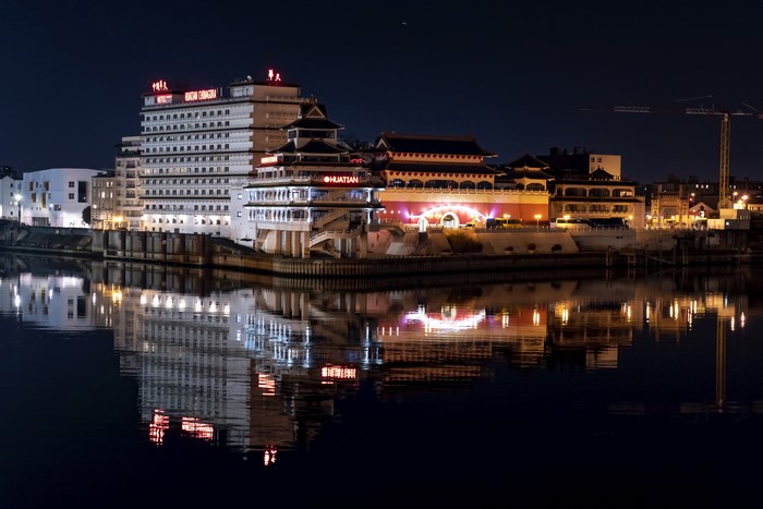 Huantian Hotel by the River at Night