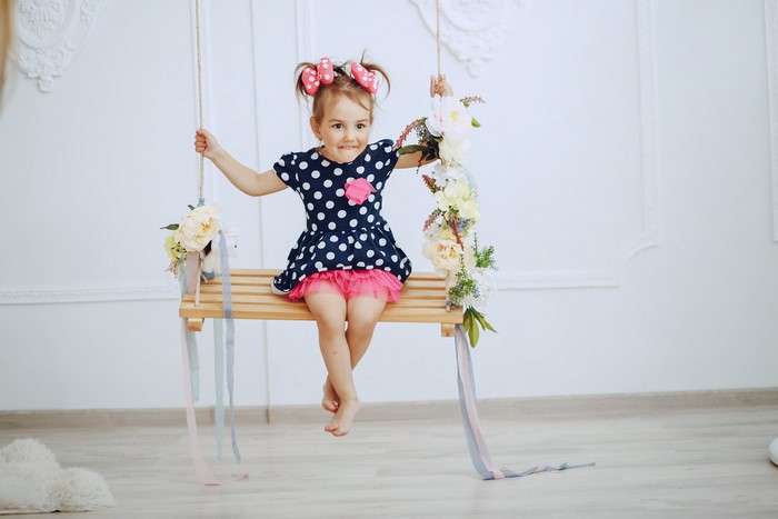 Girl on a decorated swing