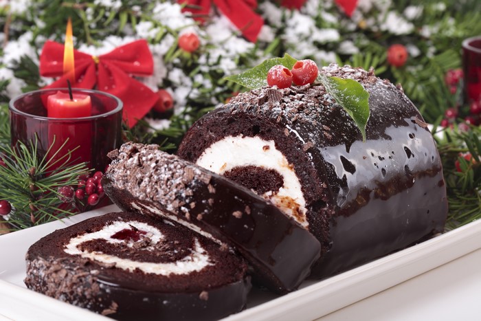 Christmas Swiss Roll with Candle and Decorations