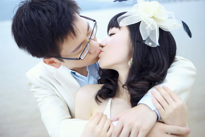 Couple kissing on a beach