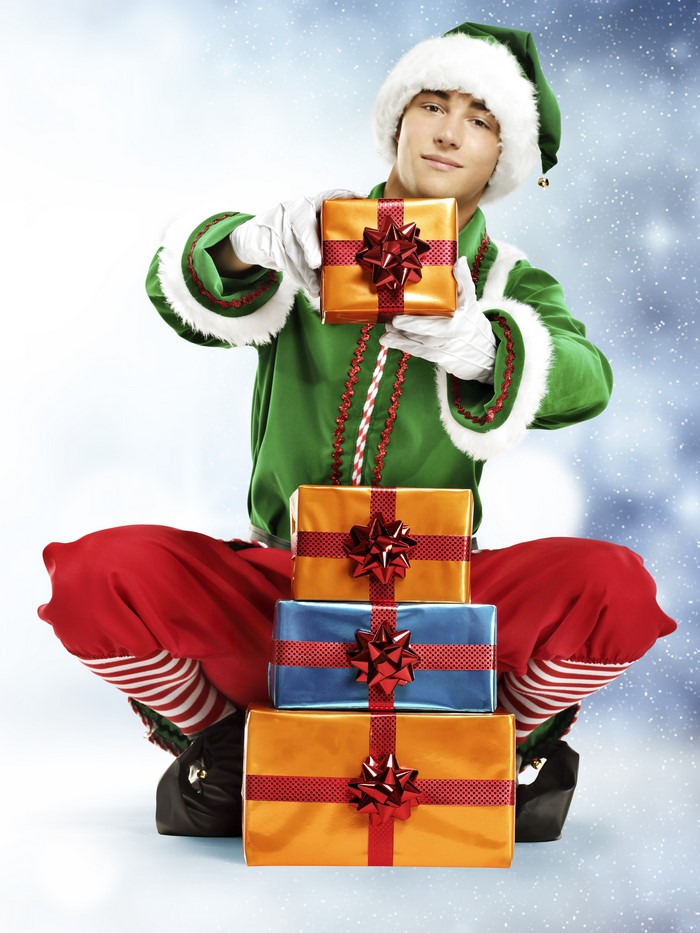Elf holding Christmas gifts