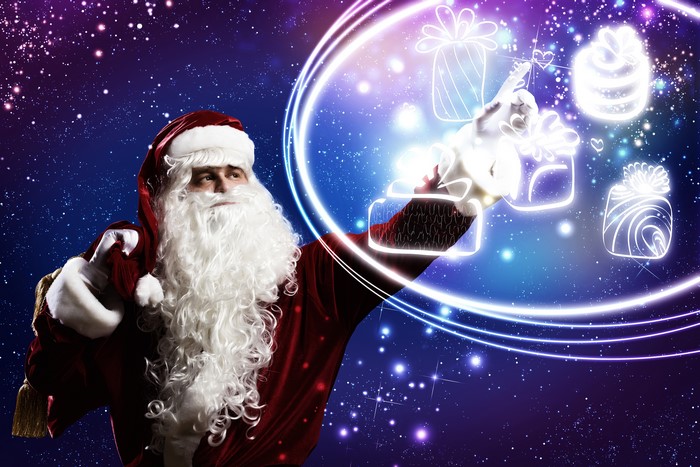 Santa Claus with glowing gifts in starry sky