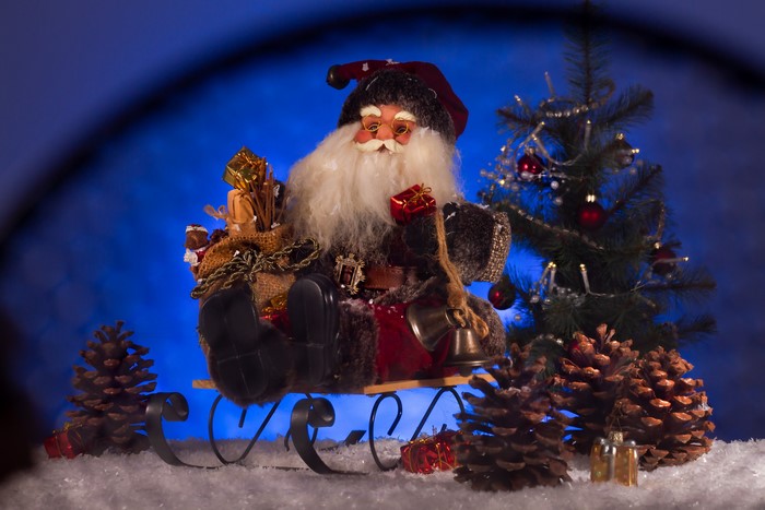 4K Santa Claus in Sled with Christmas Tree and Pine Cones