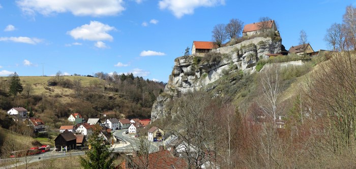 Houses and Castle on a Rocky Hillside in Bavaria, Germany