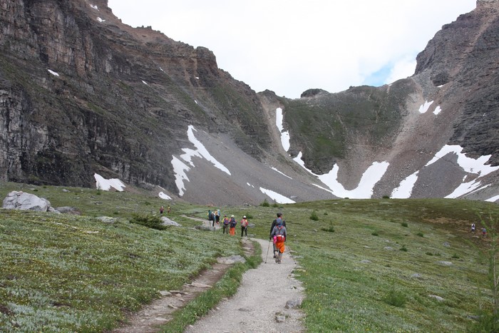 People hiking on a mountain trail in Banff National Park, Canada