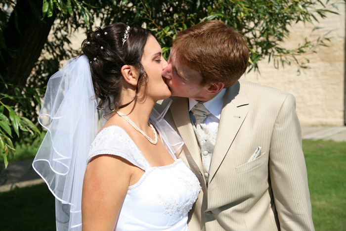 Bride and Groom kissing during wedding