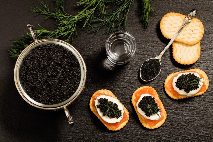 Caviar with crackers and dill