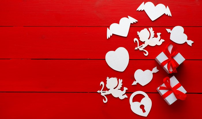 Valentine's Day Hearts, Cupids, and Gifts on Red Background