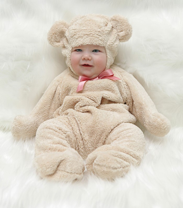 Baby in a teddy bear costume