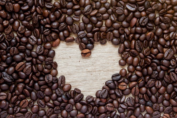 Coffee beans arranged in a heart shape