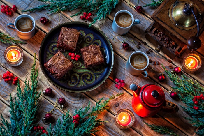 Christmas coffee and brownies with candles and decorations