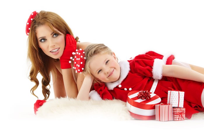 Mother and Daughter in Christmas Outfits with Gifts