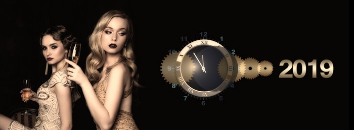 Two women with champagne glasses and 2019 clock