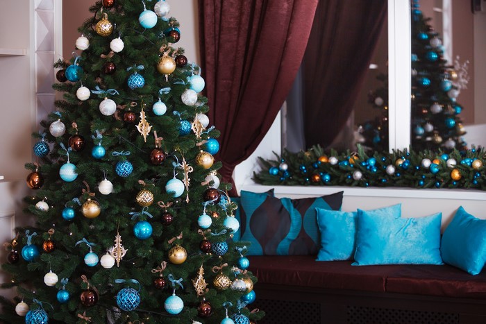 Christmas tree with blue and gold ornaments