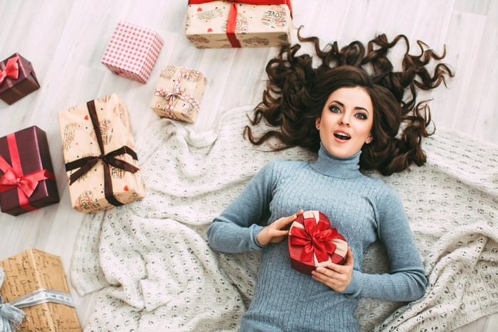 Brunette girl with Christmas gifts
