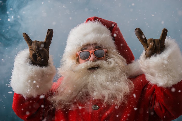 Santa Claus with sunglasses and snow