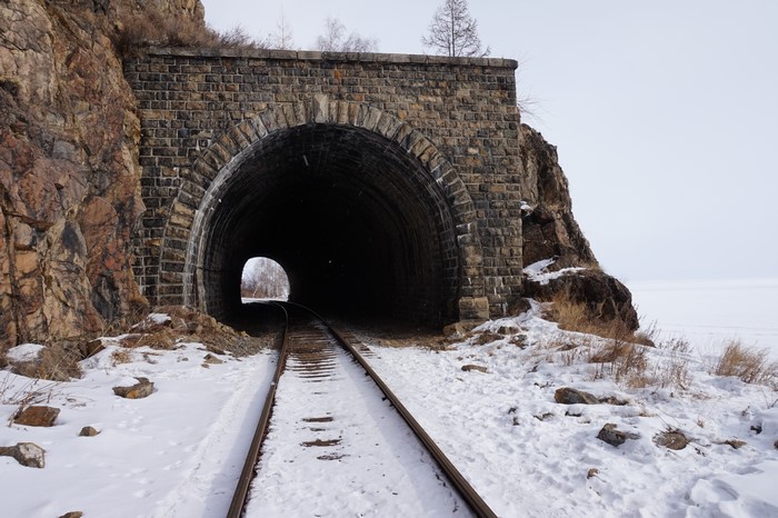 Berezovsky-pass tunnel in winter with railroad tracks