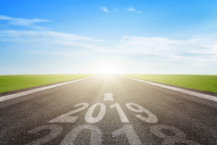 Road with 2019 painted on it under blue sky