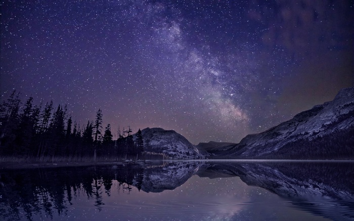 Milky Way over a mountain lake at night