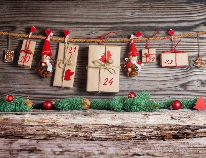 Christmas Advent Calendar Gifts on Wooden Wall