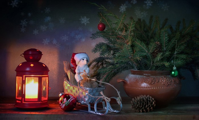 Christmas still-life with lantern, sled, and tree